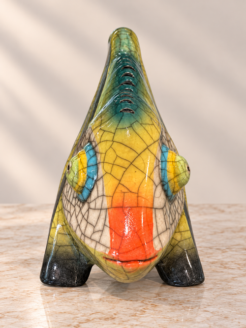 Front view of handmade Raku ceramic chameleon showing raised eyes and distinctive crackle glaze