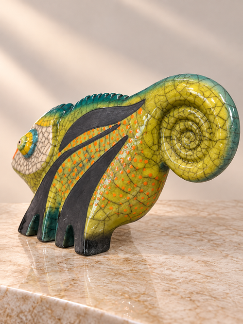 Raku pottery chameleon sculpture showing detailed curled tail, crackle glaze and hand-finished pattern