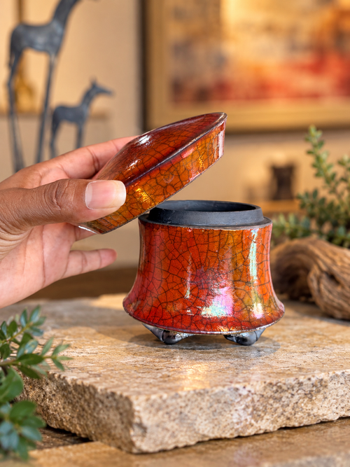 One-of-a-kind ferric chloride Raku pottery by Bob Smith shown with its removable lid and distinctive crackled surface