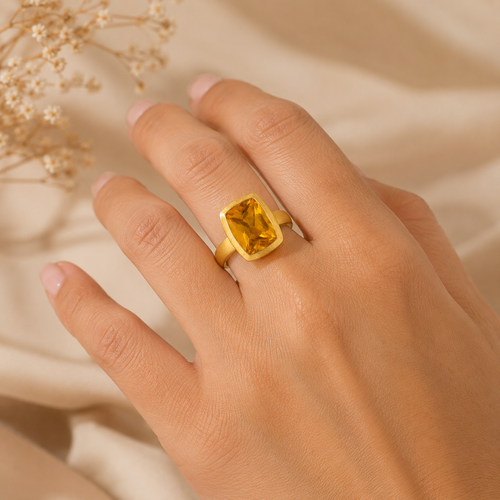 Rectangular citrine statement ring worn on hand, handcrafted brushed gold vermeil fine jewelry featuring a vibrant golden citrine gemstone.