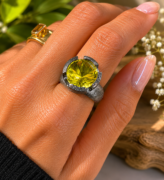 Close-up of a faceted 11x11mm round Lemon Quartz gemstone in a handmade oxidized sterling silver ring.