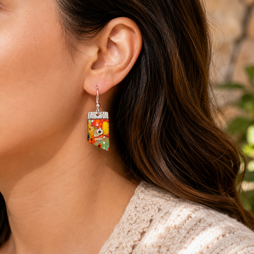 Small colorful sterling silver earrings shown on model ear, lightweight everyday earrings for women.