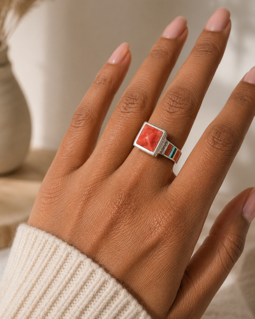 Spiny oyster and chrysocolla ring in 950 sterling silver worn on hand showing square statement design