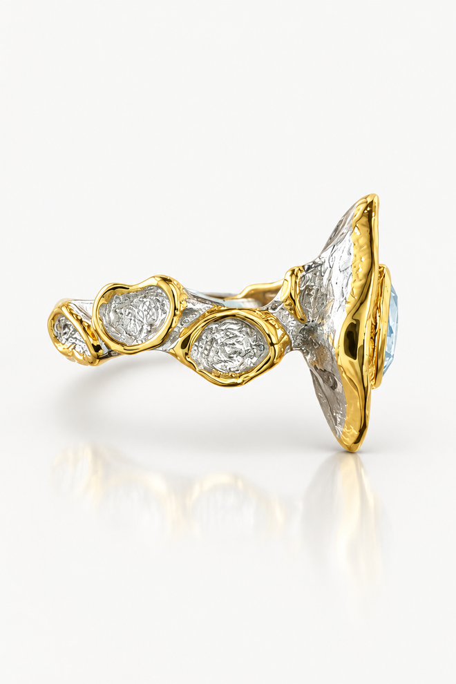 Swiss blue topaz and blue sapphire statement ring with sculptural sterling silver band and 18K gold-plated details