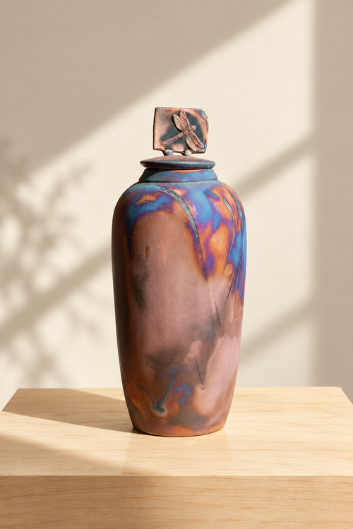 Tall one-of-a-kind dragonfly Raku pottery vessel handmade in Arizona with sculptural lid and metallic fired finish