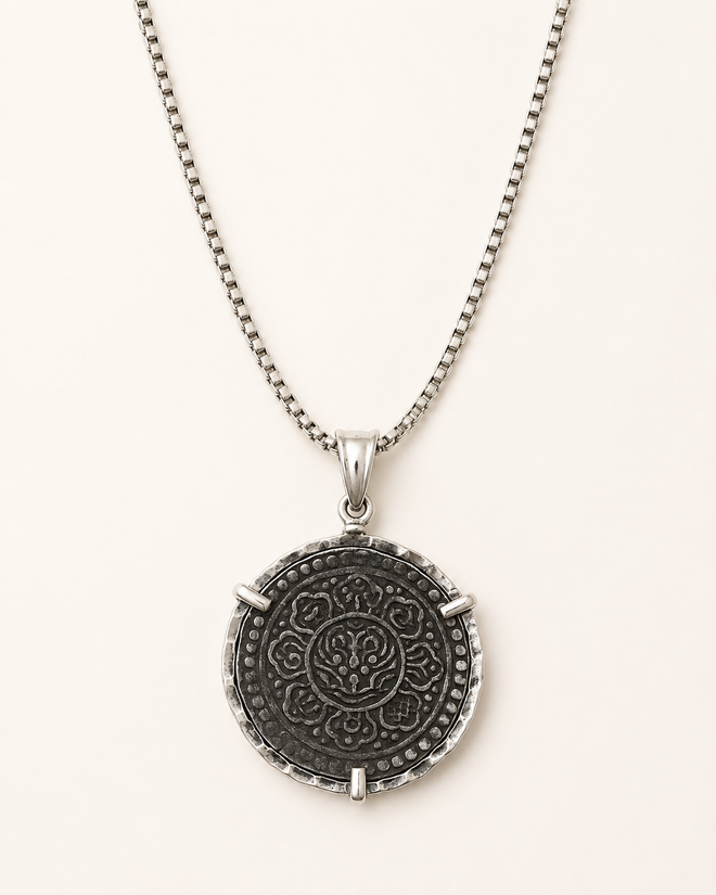 Reversible Tibetan Ga-Den Tangka coin necklace showing detailed symbolic design