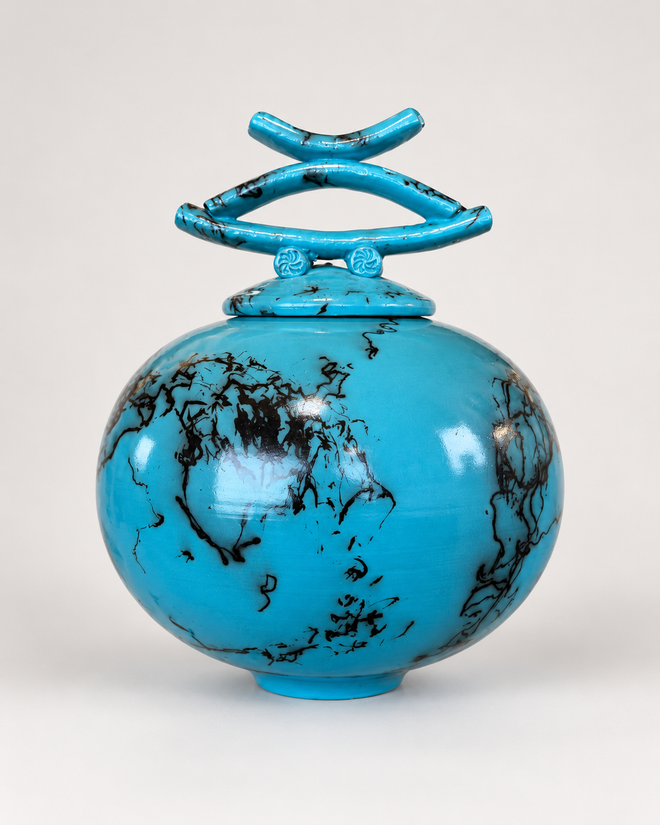 Turquoise horsehair raku lidded vessel with sculptural lid and organic black firing patterns