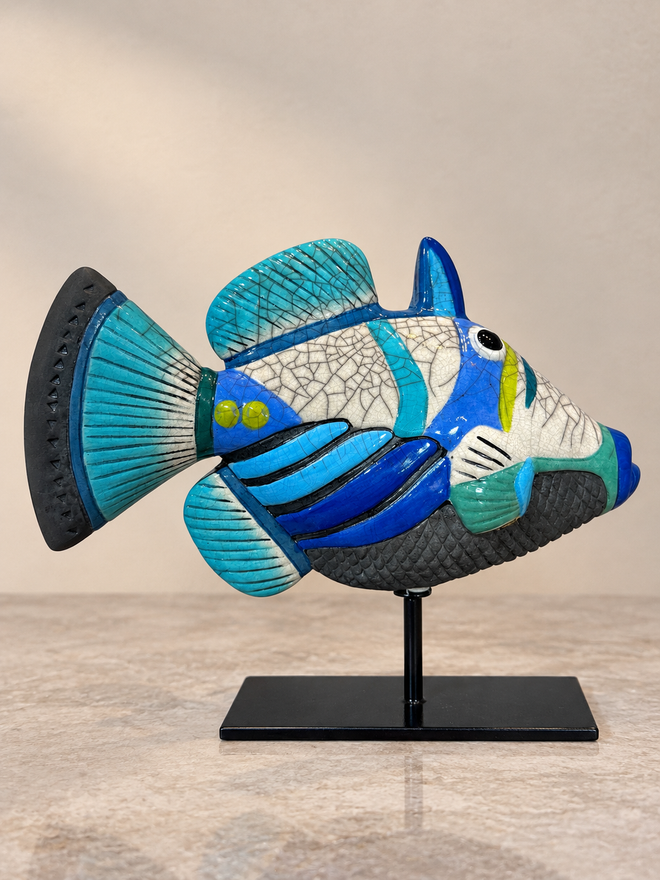 Opposite side of blue and turquoise Raku Picasso fish sculpture showing handmade crackle glaze and ceramic pattern