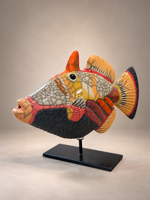 Other side of handmade Raku Picasso fish sculpture showing colorful ceramic patterns and crackle glaze