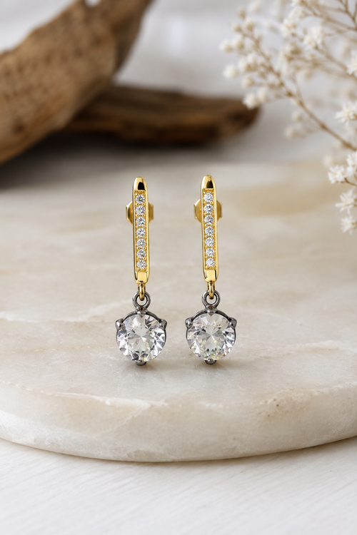 Two-tone sterling silver crystal drop earrings featuring a gold-plated bar with seven white crystals and a 6mm round crystal set in oxidized sterling silver.