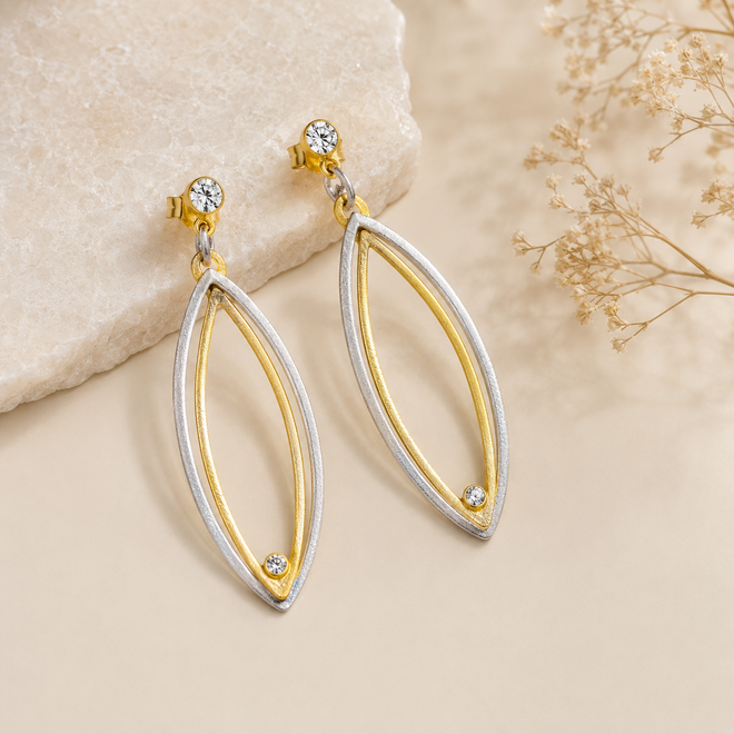 Two-tone sterling silver and gold vermeil earrings with cubic zirconia accents, handcrafted artisan jewelry available at Raku Gallery in Jerome Arizona near Sedona.