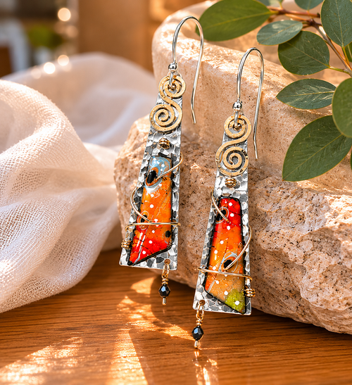 Unique orange sterling silver earrings with artistic handcrafted details and lightweight design.