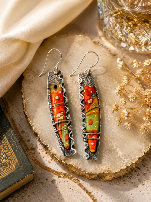 Unique orange art glass earrings handcrafted in sterling silver with colorful modern design.