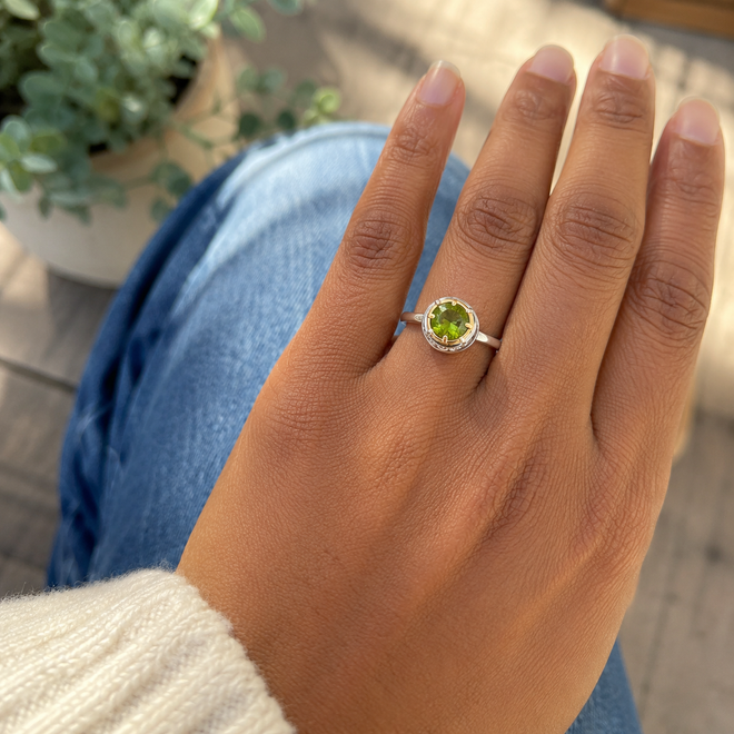 Woman wearing 6mm round peridot sterling silver ring with 18k gold vermeil accent in casual everyday style.

Curated at Raku Gallery in historic Jerome, Arizona, near Sedona