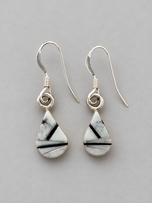 Black and white sterling silver earrings featuring White Buffalo Turquoise and Black Jade geometric stone inlay with delicate French hooks.
