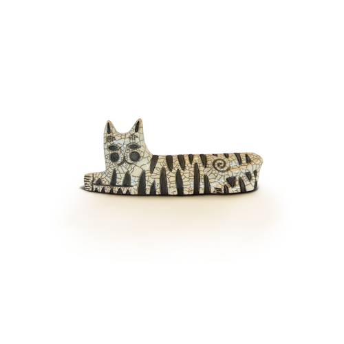 White raku ceramic cat sculpture with whimsical face and reclining body
