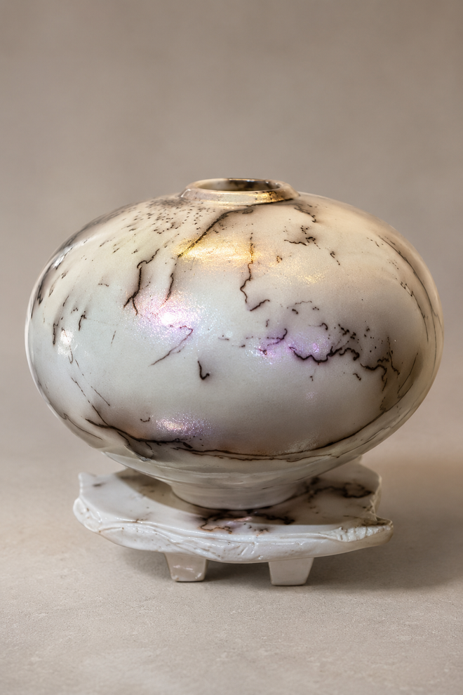 White horsehair Raku vessel with opalescent glaze on sculptural altar base by Bob Smith