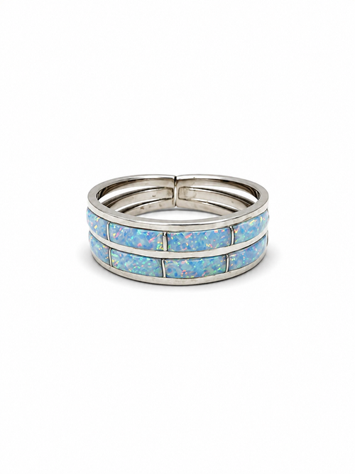 White cultured opal inlay sterling silver ring by Cynthia Johnson with two rows of colorful opal
