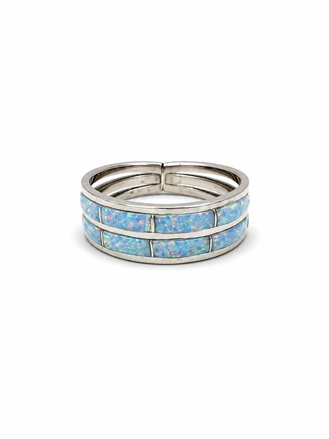 White cultured opal inlay sterling silver ring by Cynthia Johnson with two rows of colorful opal